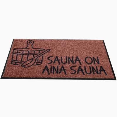 Ruskea saunan matto - "Sauna on aina sauna"